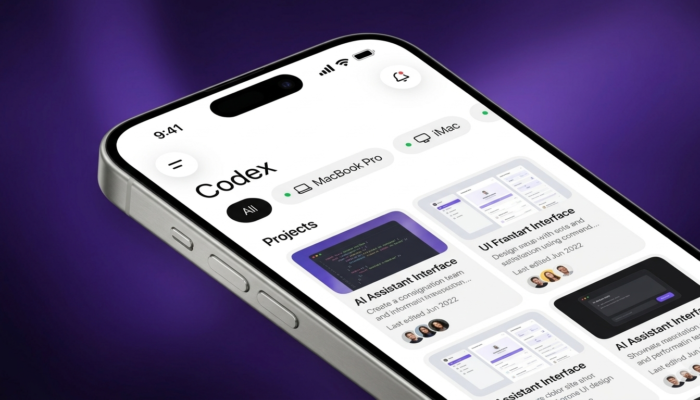 Developer using OpenAI Codex mobile coding assistant on a smartphone while working remotely