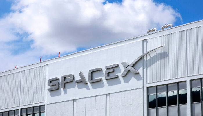 Conceptual illustration of SpaceX and Cursor logos representing a proposed $60 billion acquisition deal in the artificial intelligence and developer tools sector.
