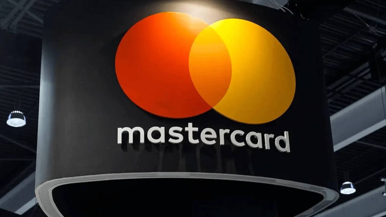 Mastercard and Solana logos connected by AI and blockchain payment network visuals representing intelligent digital transactions