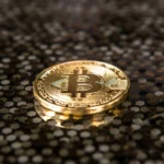 A BlackRock logo displayed alongside Bitcoin and Ethereum symbols with a downward market chart, illustrating the decline in crypto assets despite strong investor inflows.