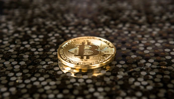 A BlackRock logo displayed alongside Bitcoin and Ethereum symbols with a downward market chart, illustrating the decline in crypto assets despite strong investor inflows.