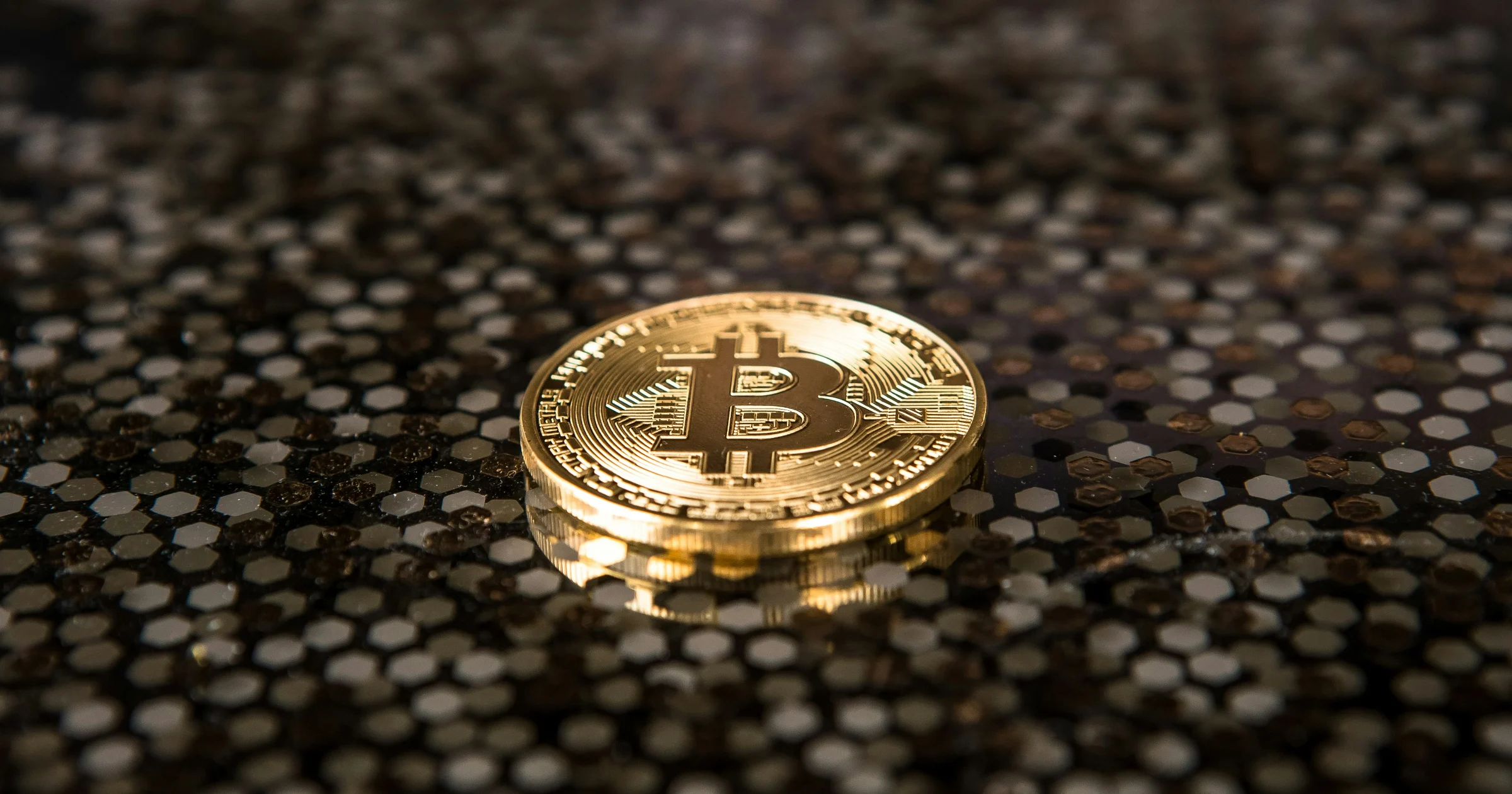 A BlackRock logo displayed alongside Bitcoin and Ethereum symbols with a downward market chart, illustrating the decline in crypto assets despite strong investor inflows.
