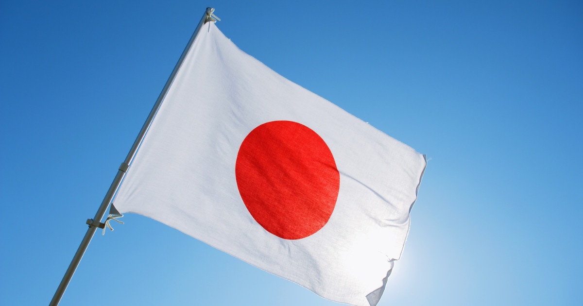 Japan's flag alongside cryptocurrency symbols, financial market charts, blockchain technology graphics, and government regulatory documents representing crypto tax reform